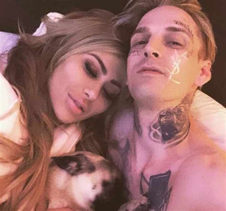 Aaron Carter declares himself single in nude photo after his girlfriend 'is arrested for domestic violence'