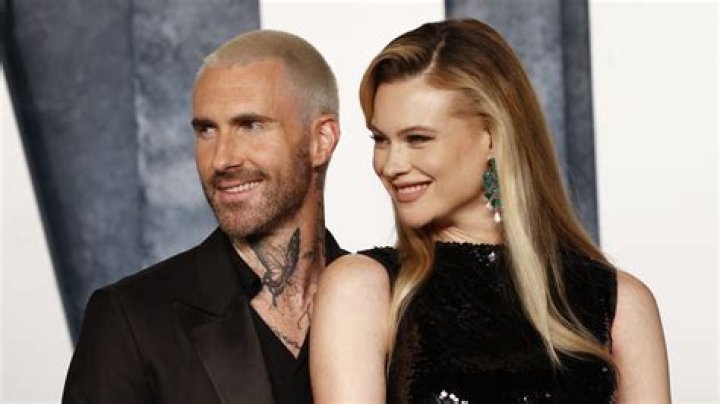 Adam Levine Dyes His Hair Platinum Blonde, Poses With Behati Prinsloo