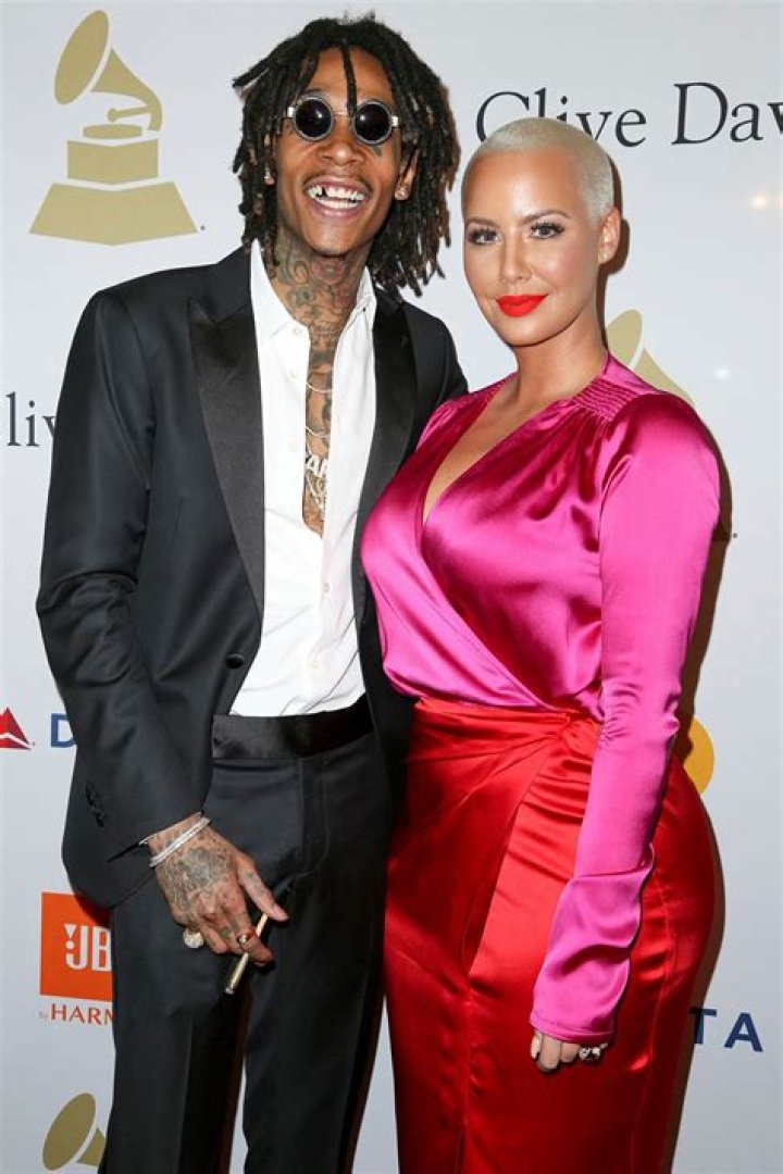 Amber Rose and Ex Wiz Khalifa Hold Hands, Kiss at Pre-Grammys Bash
