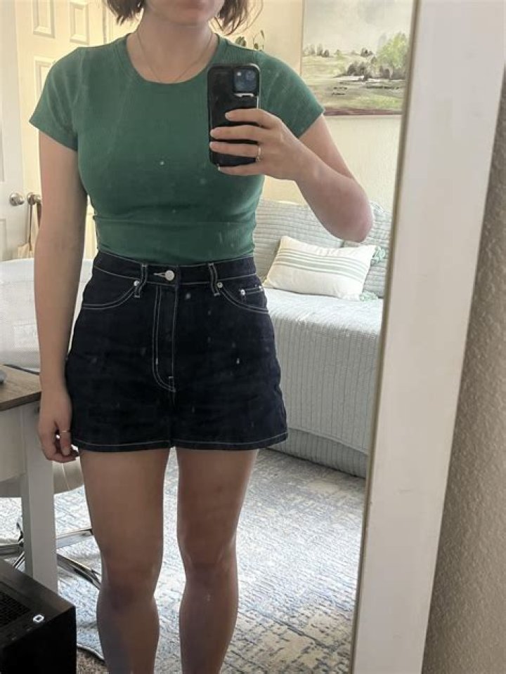 Duggar rebel cousin Amy poses in a crop top & tiny jean shorts as she continues to defy famous family's dress code