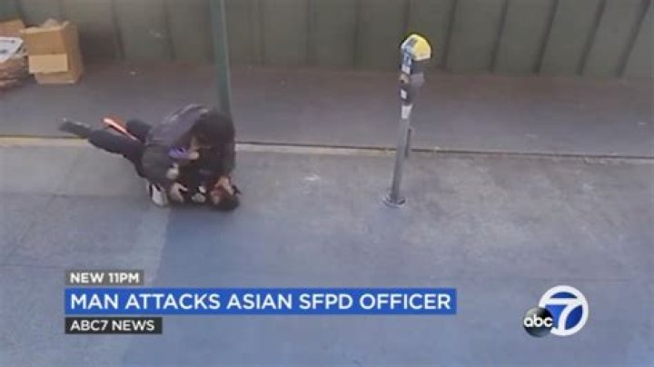 Female cop saved by bystanders as homeless man who said he 'specializes in killing Asian people' has her in 'death grip'