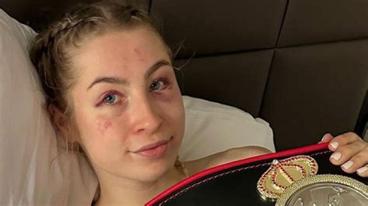 Astrid Wett poses topless in bed after beating AJ Bunker in Misfits fight but fans call new strap a 'Toys R Us belt'