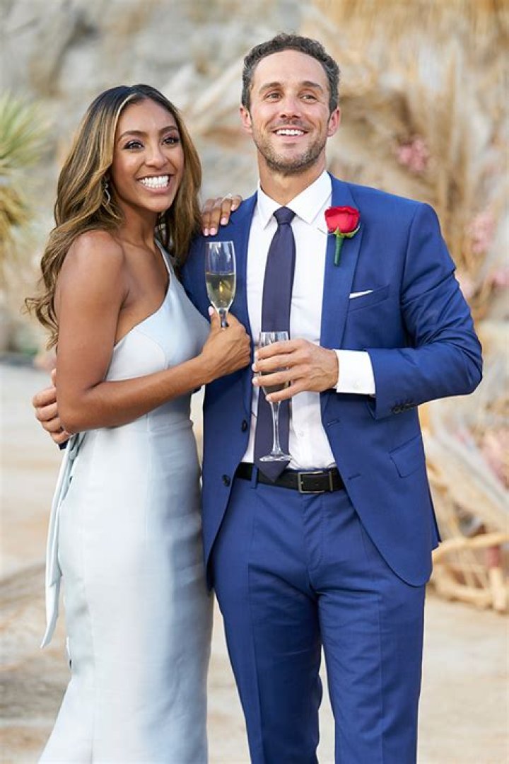 Bachelorette Tayshia Adams and fiance Zac Clark can't keep their hands off each other as he grabs her butt on coffee run