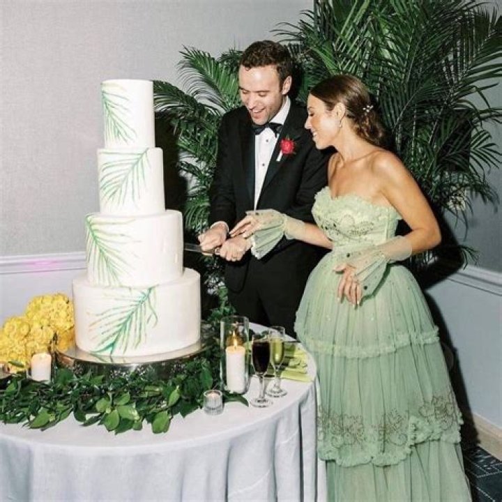 We banned family from our £400 wedding but I loved my £12 dress & cut the £9 cake on our kitchen worktop