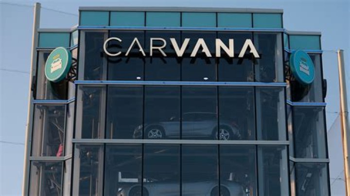 Carvana sued by angry customers who were 'ARRESTED over company errors' after 2,500 staff are laid off - many on Zoom'