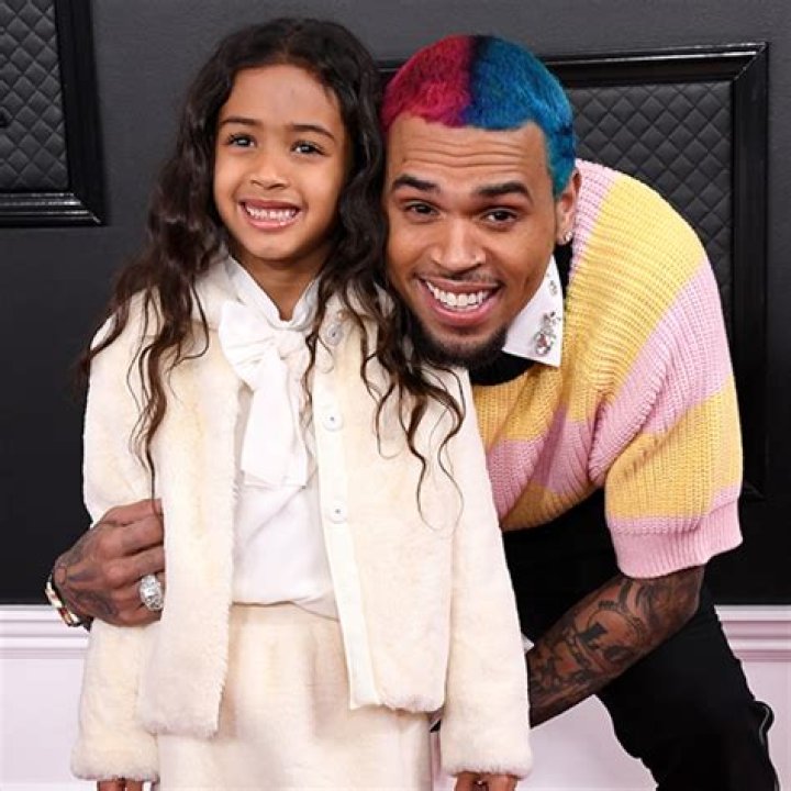 Chris Brown looks sullen at daughter Royalty's pony-themed 7th birthday after star looked unrecognizable at Drake's bash