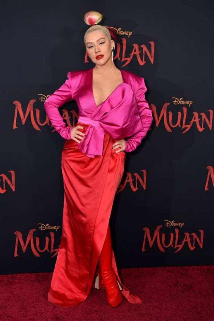 Christina Aguilera shows off curves in red silk skirt and latex boots at the Mulan premiere – The US Sun