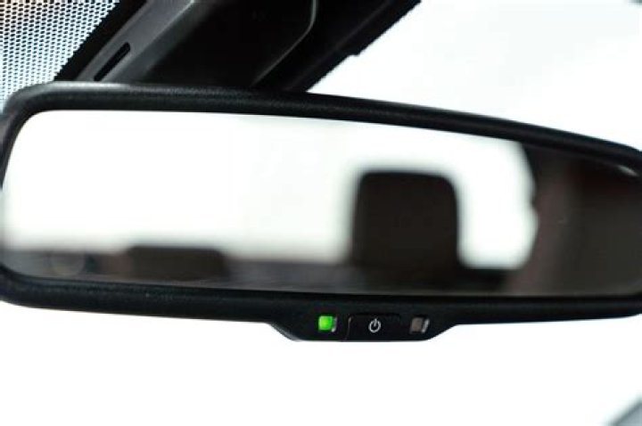 Drivers stunned to learn what the 'secret' button on rear view mirror is really for