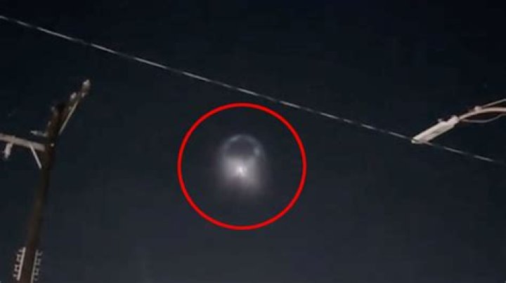 Eerie video shows ‘disc-shaped’ UFO with giant halo cruising over town - sparking invasion fears