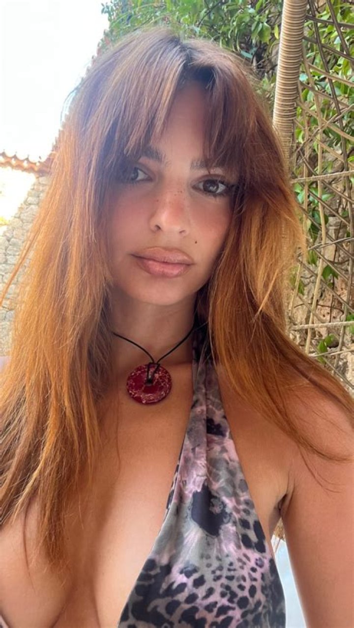 Emily Ratajkowski shares close-up photo of her chest in a low-cut top and shows off sweet tribute to son Sylvester, 2