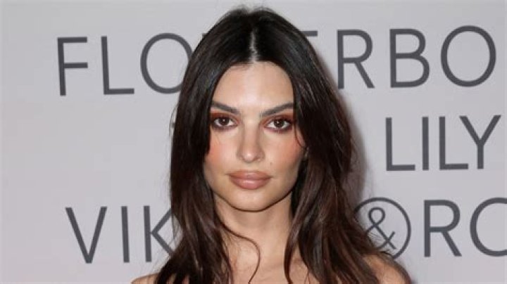 Emily Ratajkowski slams trolls calling her a 'bimbo' for 'showing cleavage' as she rocks plunging top at NYC home
