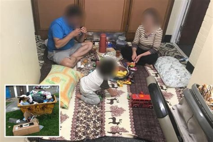 Family 'forced to live in HALLWAY of tower block full of dead birds, rotting rubbish and mould'