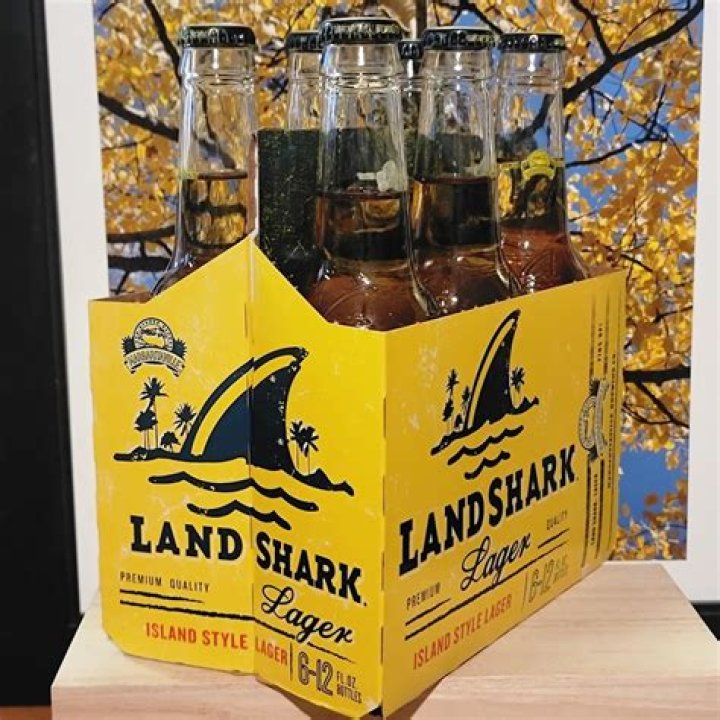 Fury as fishermen pin down shark and use its teeth to open can of beer