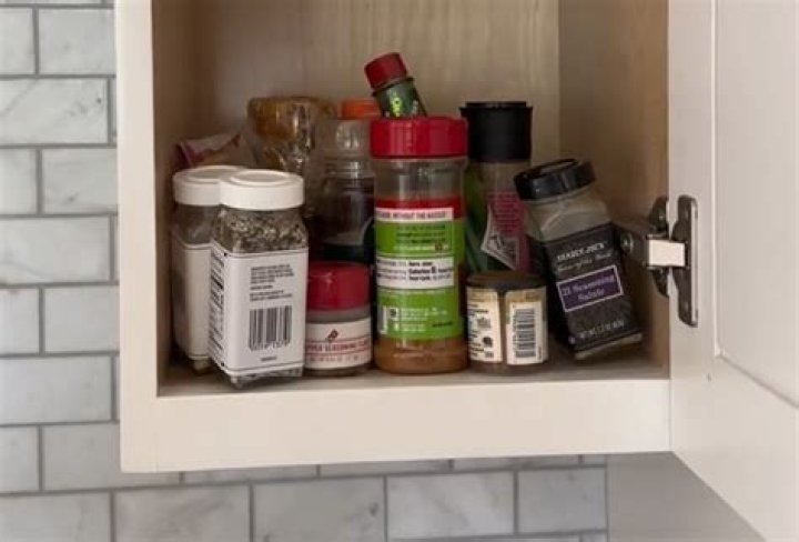 I built a hidden spice rack in my kitchen - it's more organized than my messy cabinets, you wouldn't know they're there