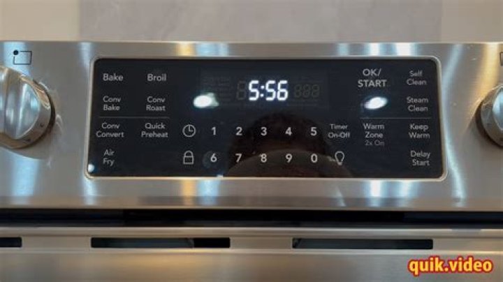 How do I reset the clock on my Kenmore stove?