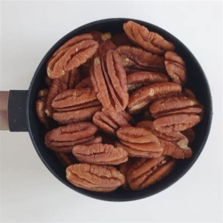 How much does a cup of pecans weigh?