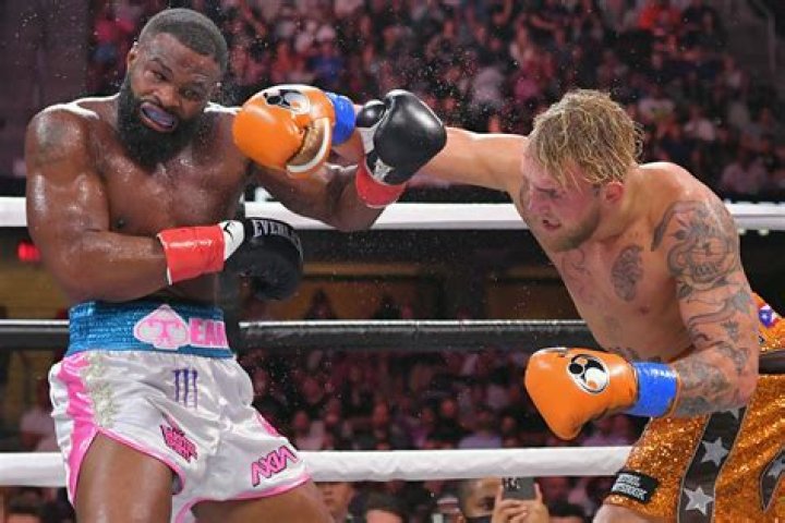 Jake Paul QUITS boxing after defeating UFC champ Tyron Woodley & claiming he banked $100M in big fight