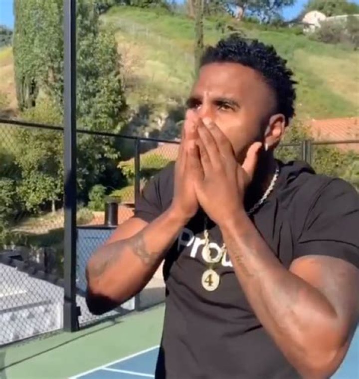 Jason Derulo shares video shaving off his eyebrow after losing a bet as he says he 'had to do it'
