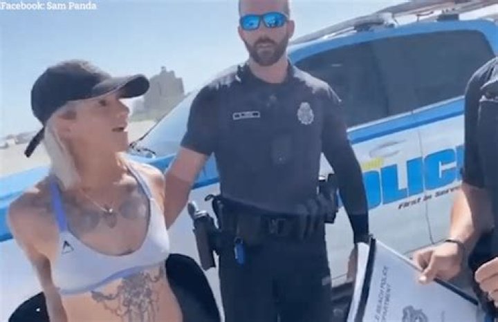 Thong bikini-clad acrobat Sam Panda arrested and ‘manhandled’ on beach after ‘Karen’ called police over skimpy outfit