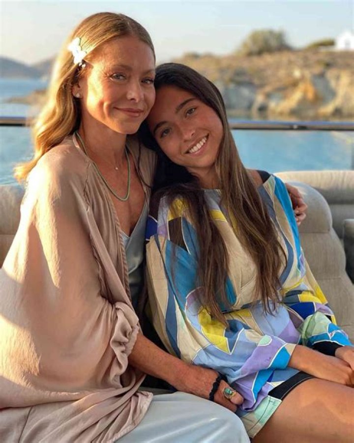 Kelly Ripa’s rarely-seen daughter Lola Consuelos, 21, promotes her new song in a bikini & sheer robe in a TikTok video