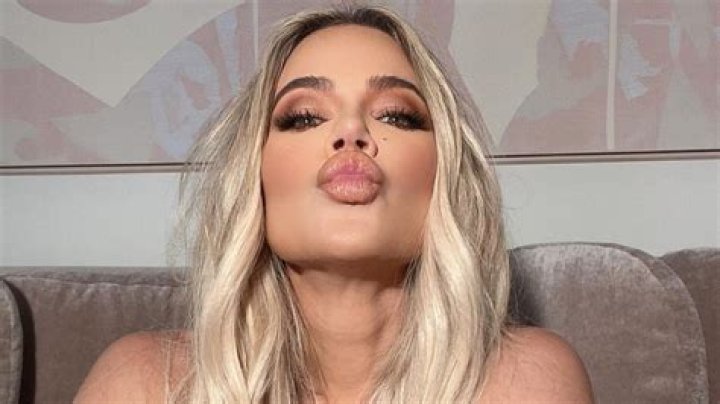 Khloe Kardashian accused of 'photoshop' as she poses in skintight crop top and heels after admitting she had a nose job