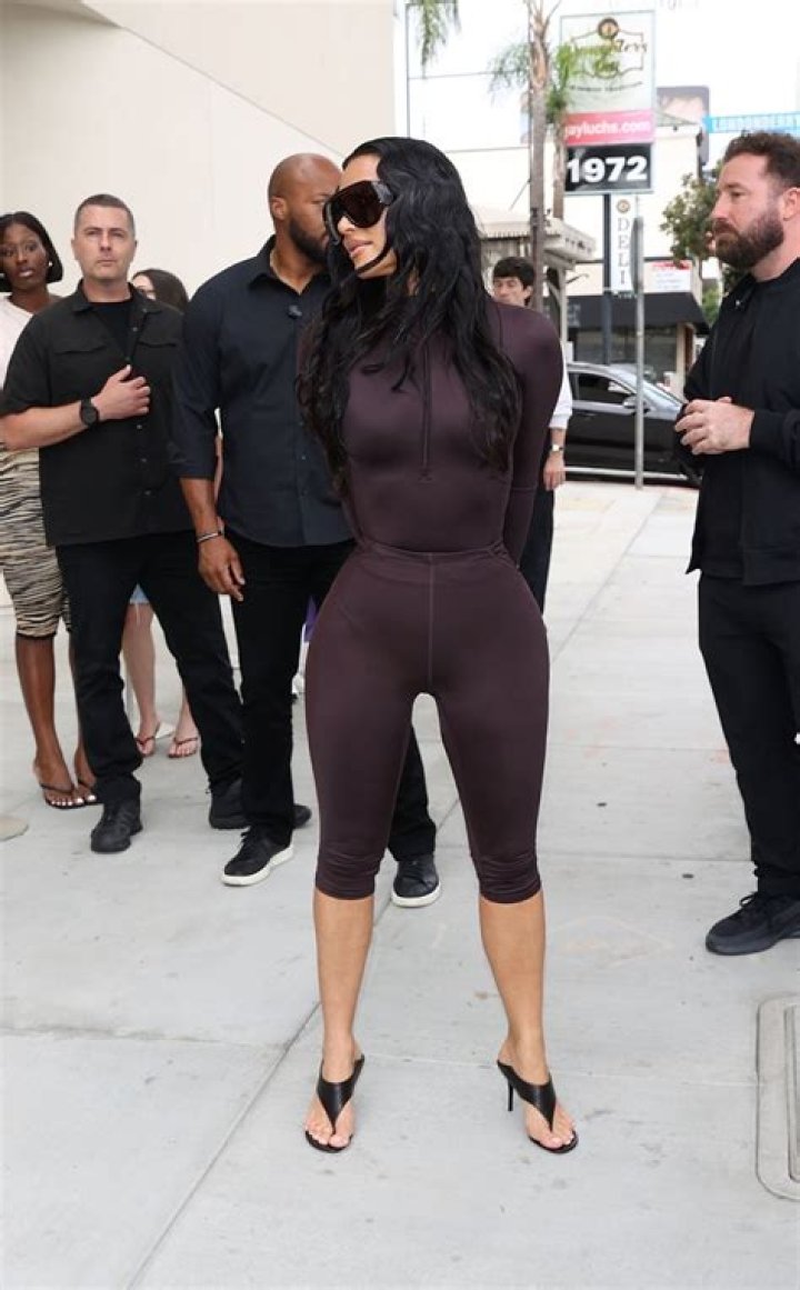 Kim Kardashian Embraces Pregnancy Curves in Sheer Shirt, Black Bra: Picture