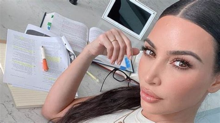 Kim Kardashian's lawyer dreams are quietly 'on pause' after she finds herself 'too busy' with businesses and 4 kids
