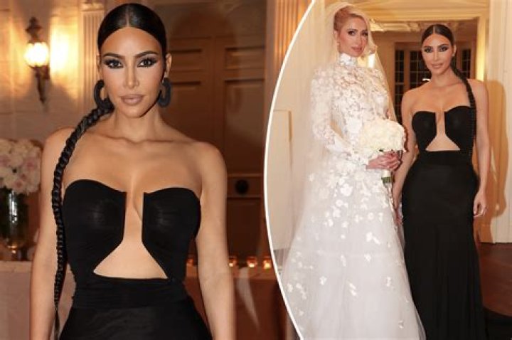 Kim Kardashian stuns in revealing black gown as she attends Paris Hilton's wedding WITHOUT 'new boyfriend' Pete Davidson