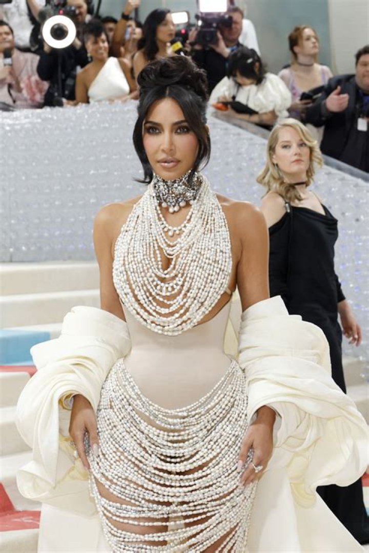 Kim Kardashian goes topless under pearl necklace at Met Gala- and fans think racy look is nod to her 2007 Playboy shoot