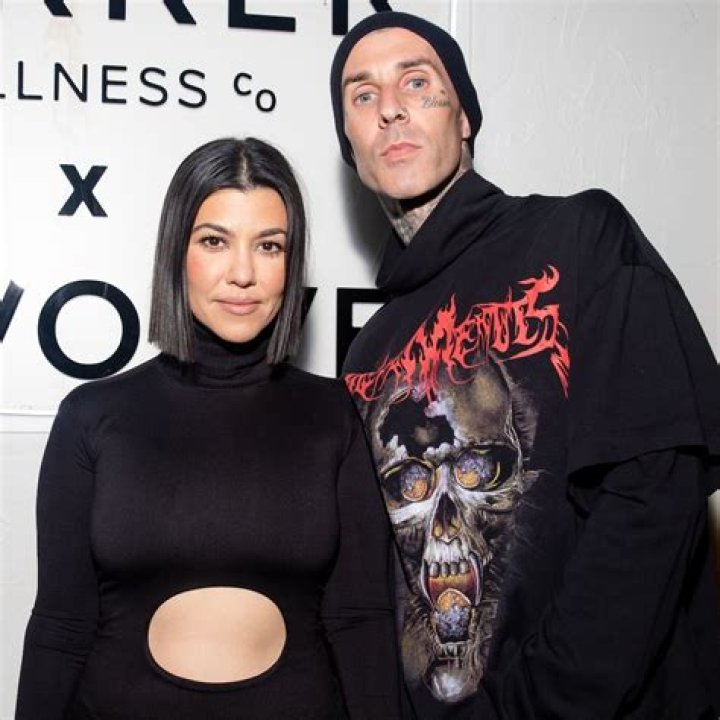 Kourtney Kardashian poses TOPLESS with Travis Barker as they quarantine together for 10 days amid fears they have Covid