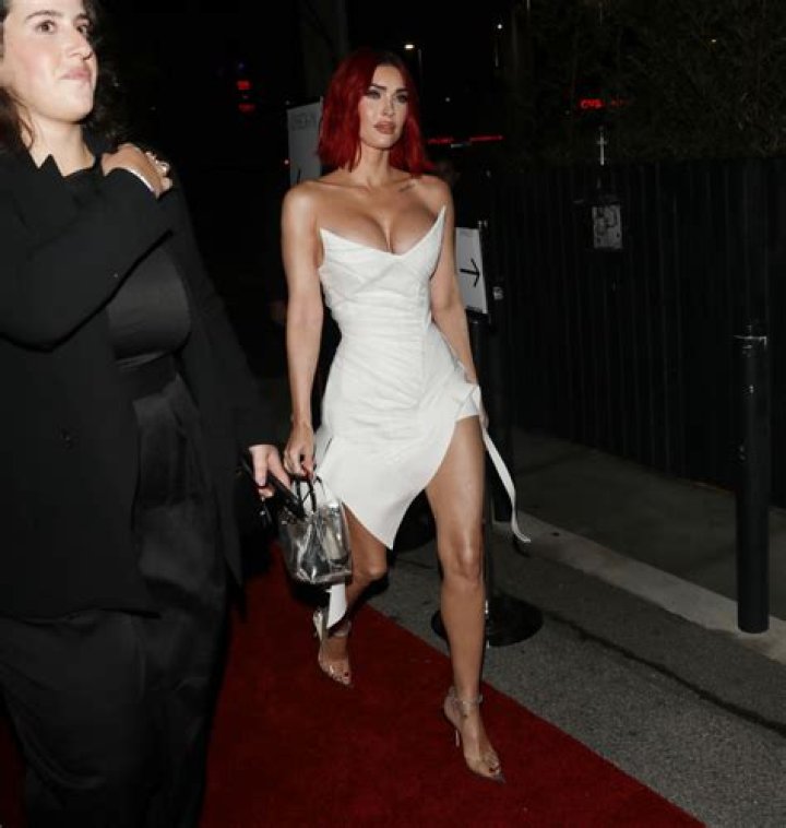 Megan Fox stuns in white dress and pink hair amid controversy over new ‘sex doll’ face