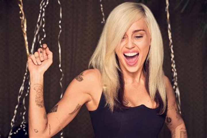 Miley Cyrus Shows Rolling Stone Tattoo After Going Topless on Cover