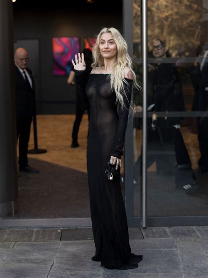 Paris Hilton Goes Without Underwear, Flaunts Abs in Sheer Dress