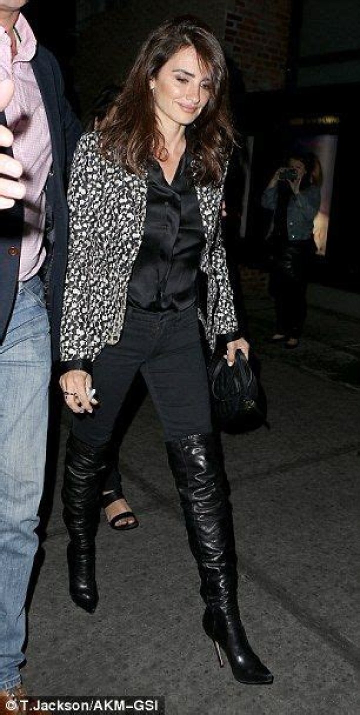 Penelope Cruz, 49, shows off her stunning figure as she dances in PVC jumpsuit and thigh-high heels