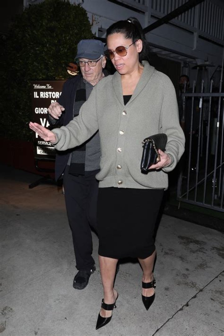 Robert De Niro's girlfriend Tiffany Chen covers up 'bump' in photos before 79-year-old revealed he welcomed 7th child