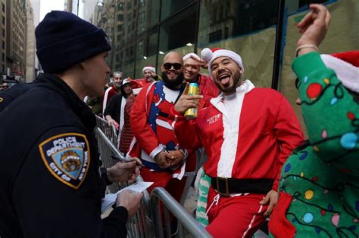SantaCon chaos descends as 30,000 boozy revelers cram into NYC for crawl - but are put off by long lines & drink prices