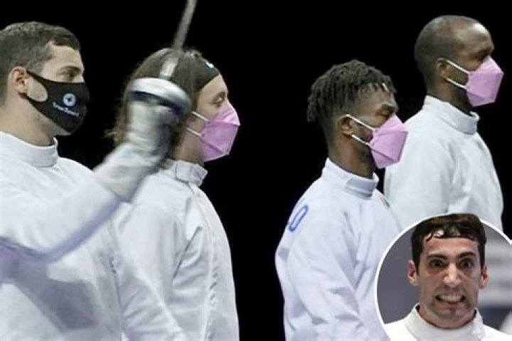 US Olympic fencing team wear pink masks in protest over OWN team-mate accused of sexual assault and banned from village