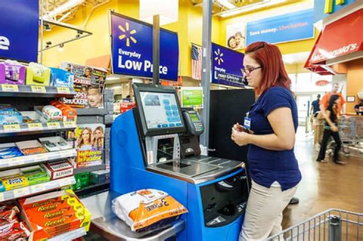 Walmart slammed by shoppers for 'awkward' signs next to unmanned self-checkout