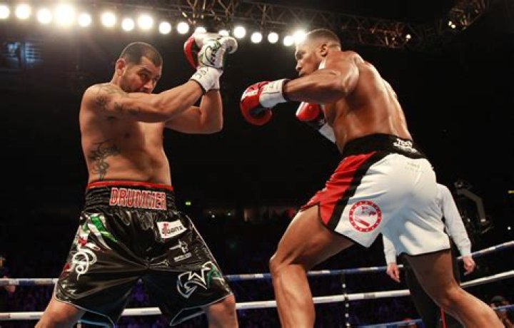 Watch crazy moment Anthony Joshua's ex-opponent Eric Molina is sent tumbling as ring COLLAPSES against De la Torre
