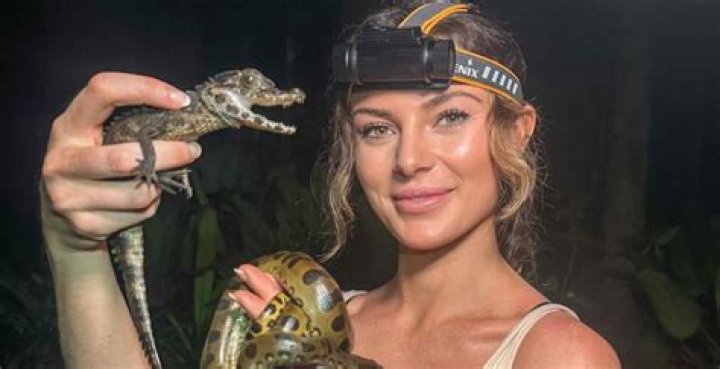 ‘World's hottest scientist’ Rosie Moore wrestles monster python with bare hands & ends up covered in blood